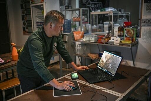 Mongkol Yingyotmongkolsaen installed low-cost, internet-connected video cameras high among treetops that share live feeds to villagers who can remotely monitor conditions in real time
