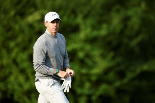 Defending champion Rory McIlroy of Northern Ireland walks on the 13th green during a practice round ahead of the 90th Masters