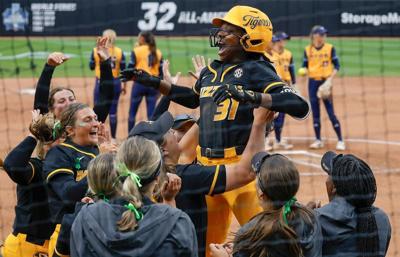 Saniya Hill gets lifted by her teammates (copy)