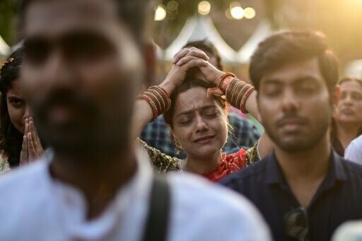 A reveller immersed in Hindu spiritual songs called 'bhajans' at the iconic Purana Qila in New Delhi on March 1, 2026