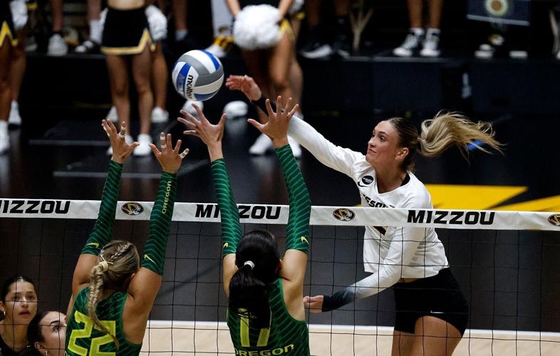 Mizzou Junior Lauren Larkin (CQ) (12) spikes a ball (copy)