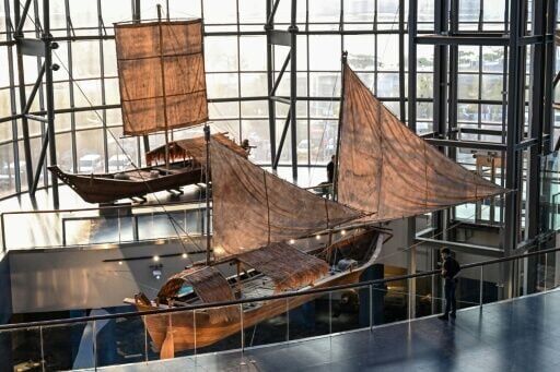 A man looks at the traditional Balangay, an ancient wooden vessel, on display at the Museo del Galeon in Manila