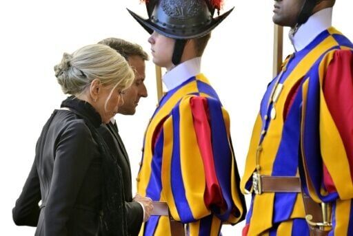 France's President Emmanuel Macron and his wife Brigitte Macron arrive for a meeting with Pope Leo XIV in the Vatican