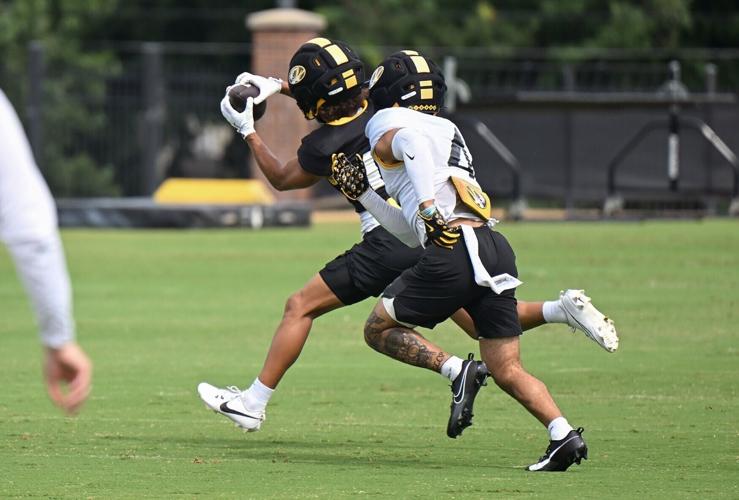 Mizzou safety Trajen Greco (4), right, covers wide out Cayden Green (19)