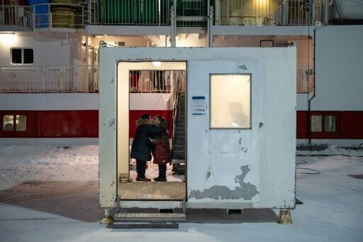Last kiss: Inuit women embrace before the Sarfaq Ittuk ferry leaves the port of Nuuk, Greenland
