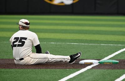 Mizzou infielder Jase Woita sits on the field after failing to tag the base (copy)