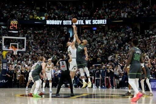 Nikola Jokic of the Denver Nuggets tips off against Rudy Gobert of the Minnesota Timberwolves in game one of their NBA Western Conference playoff series