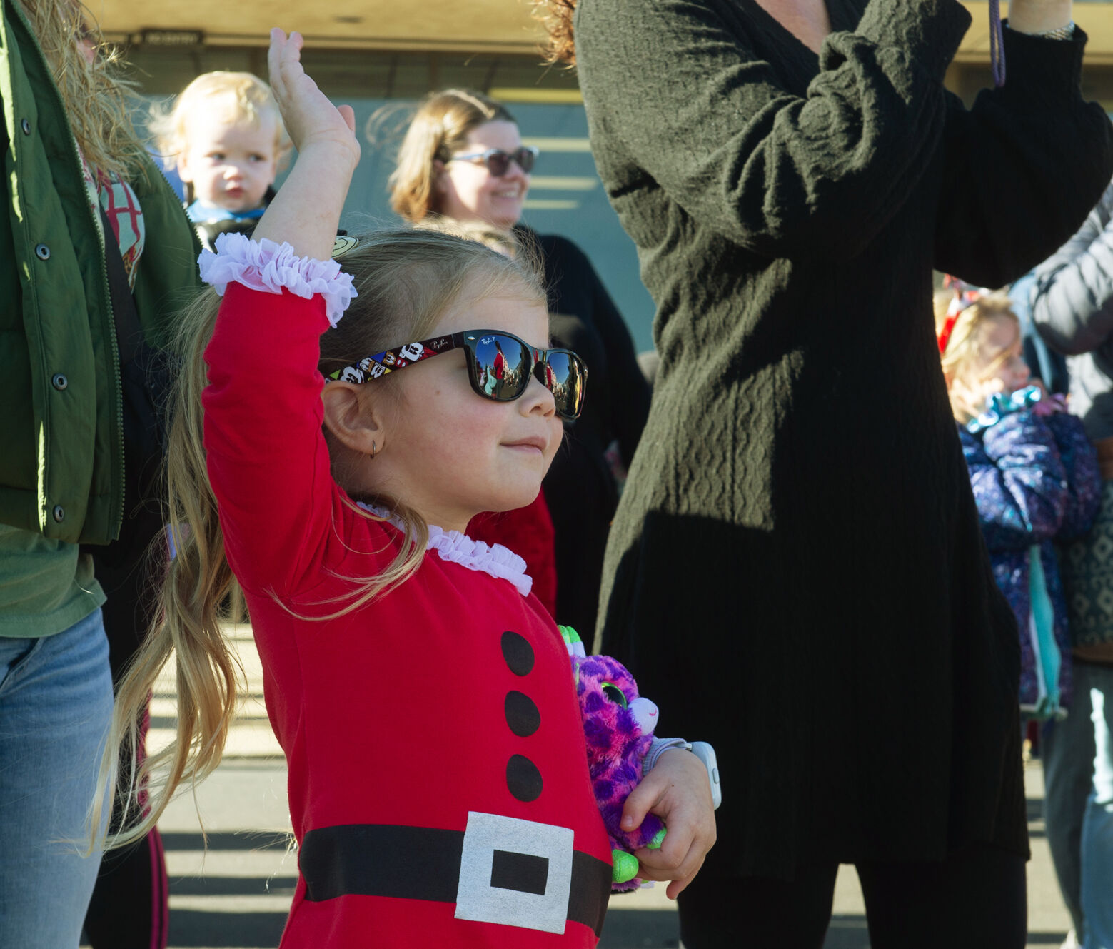 Santa Claus, greeted by a crowd of children, arrives in Joplin by