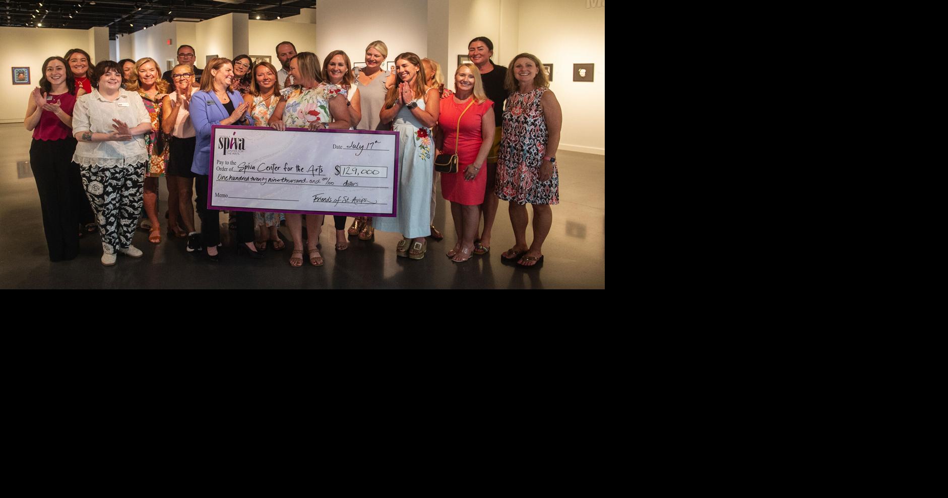 St. Avips presents $129,000 to Spiva Center for the Arts