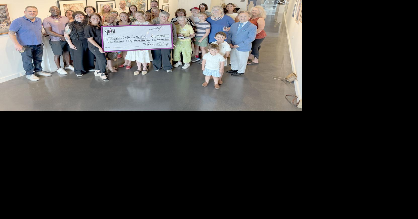 Friends of St. Avips presents check to Spiva Center