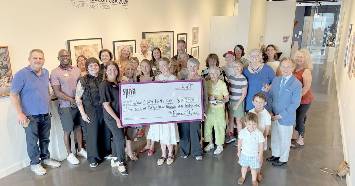 Friends of St. Avips presents check to Spiva Center