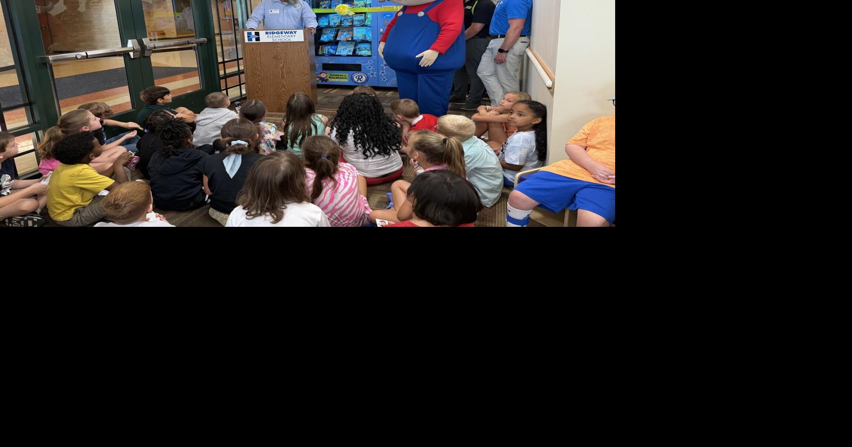 Final Hamilton school gets book vending machine, and the whole district gets more books