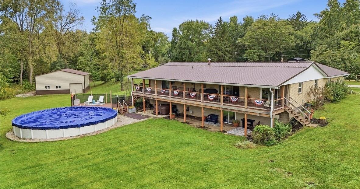 $727.7K Springfield home and property for sale has 3 barns, a fruit orchard and a creek