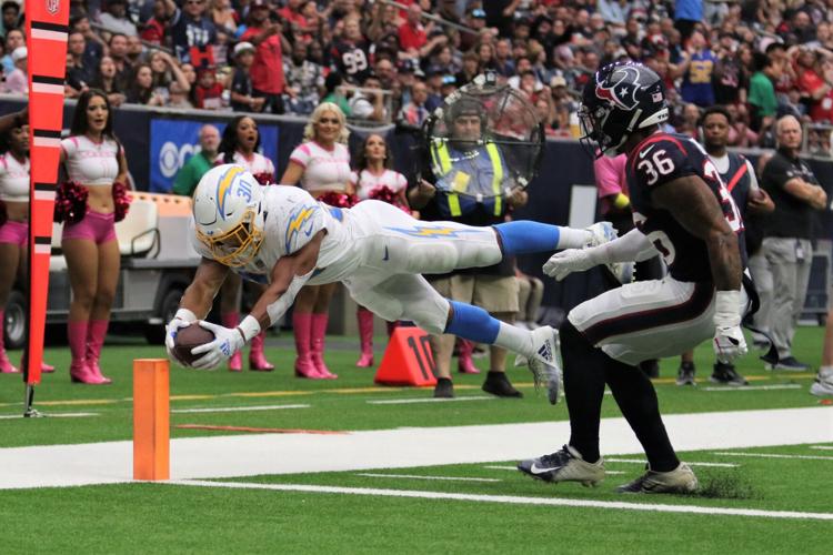 Ekeler scores 3 touchdowns, Chargers hold off Texans 34-24