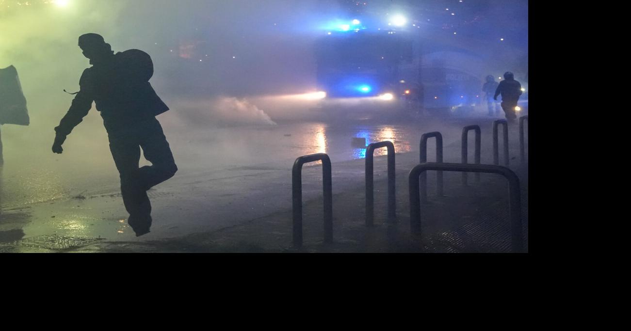 Italian police fire tear gas at protesters near Olympics venue