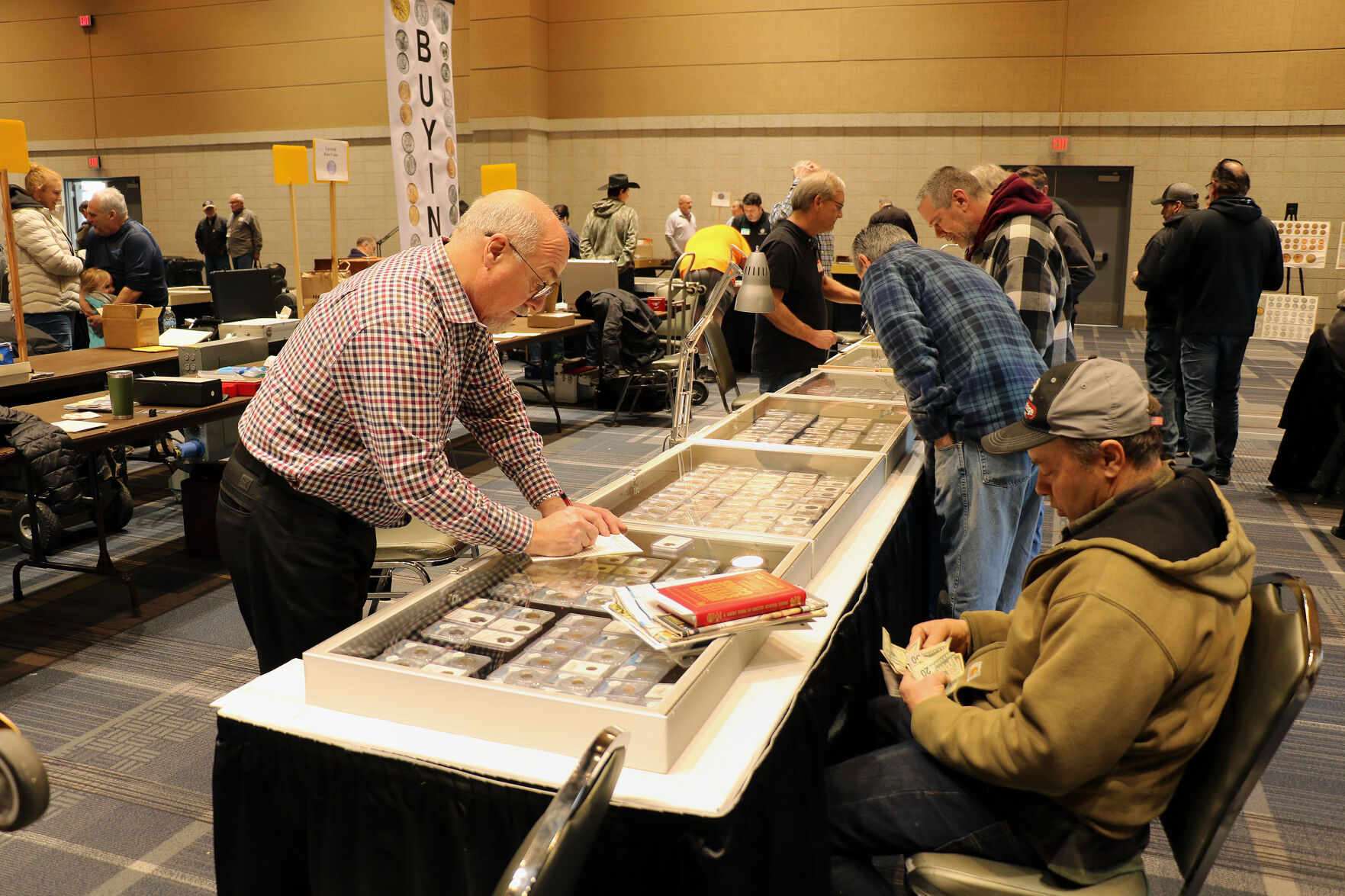 Coin collectors club members vendors gather at annual show