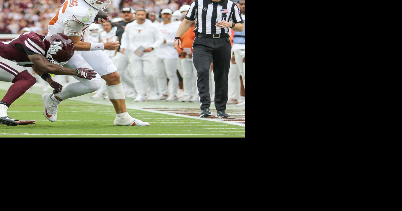 Texas' Manning apparently injured in win against Mississippi State