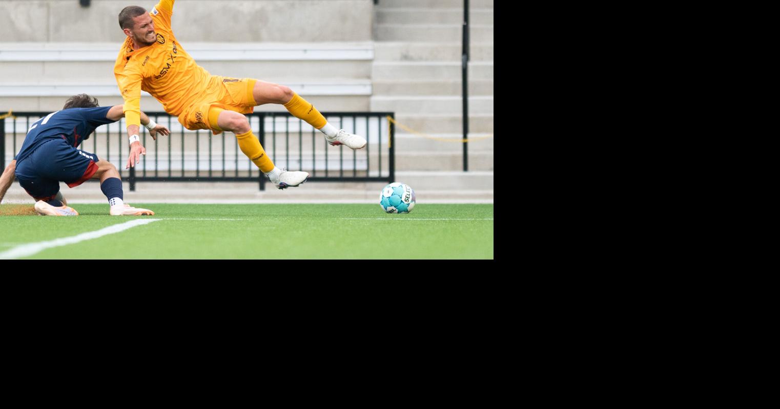 Fort Wayne FC’s Michael Rempel goes down after a slide