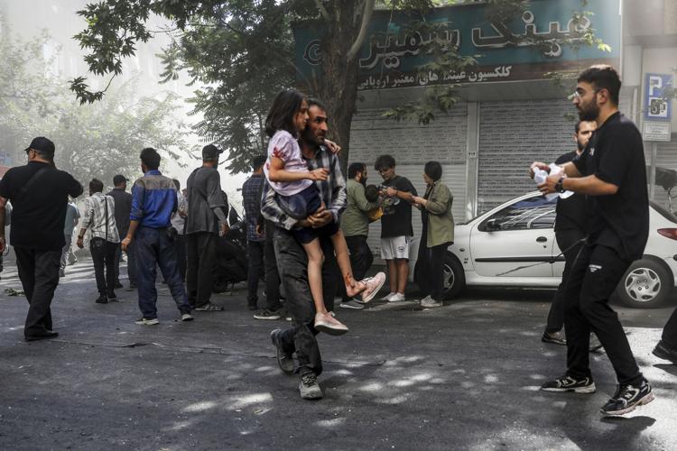 Israel and Iran trade strikes for a third day and threaten more to come