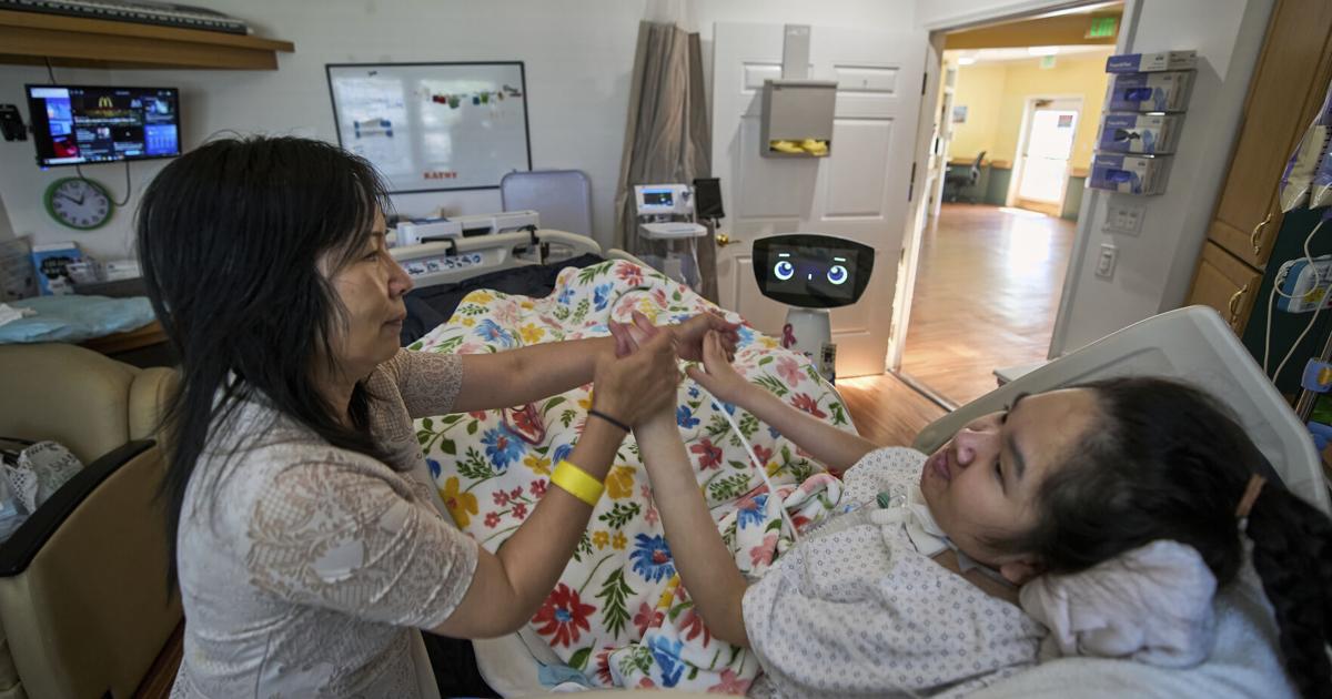A robot programmed to act like a 7-year-old girl works to combat fear and loneliness in hospitals