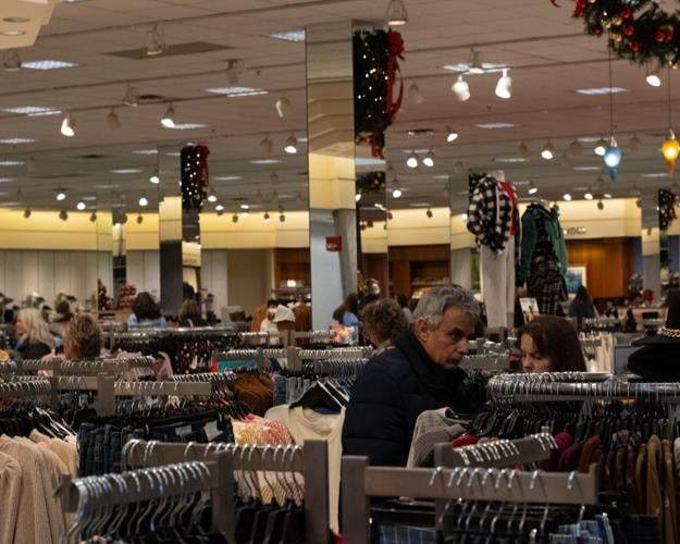 Black Friday calmer as stores spread out deals Local