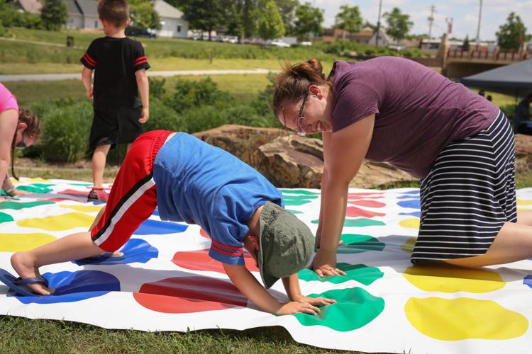 Megan Whittman and son Noah play Twister