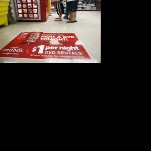 Redbox's machines take on Netflix's red envelopes