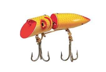 Eight vintage fishing lures incl Heddon Baby
