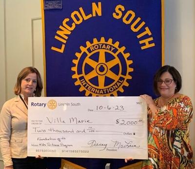 Tracey McLain presents grant to Jenny Chase