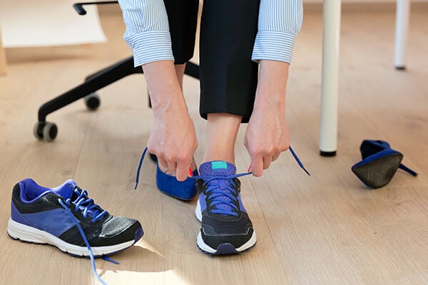 Changing shoes to take a walk