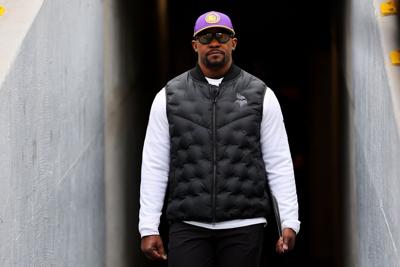 Defensive coordinator Brian Flores of the Minnesota Vikings takes the field prior to a game against the Green Bay Packers at Lambeau Field on Oct. 29, 2023, in Green Bay, Wisconsin.