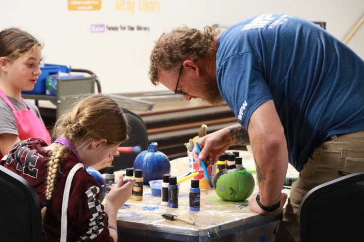 Veterans join Club Whatever members for pumpkin-painting activity