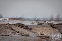 Water flowing over levee L575 across the river from Nebraska City in Percival, Iowa