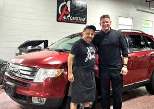 'Life changing': Lincoln auto shop owner gifts car to beloved small business owner