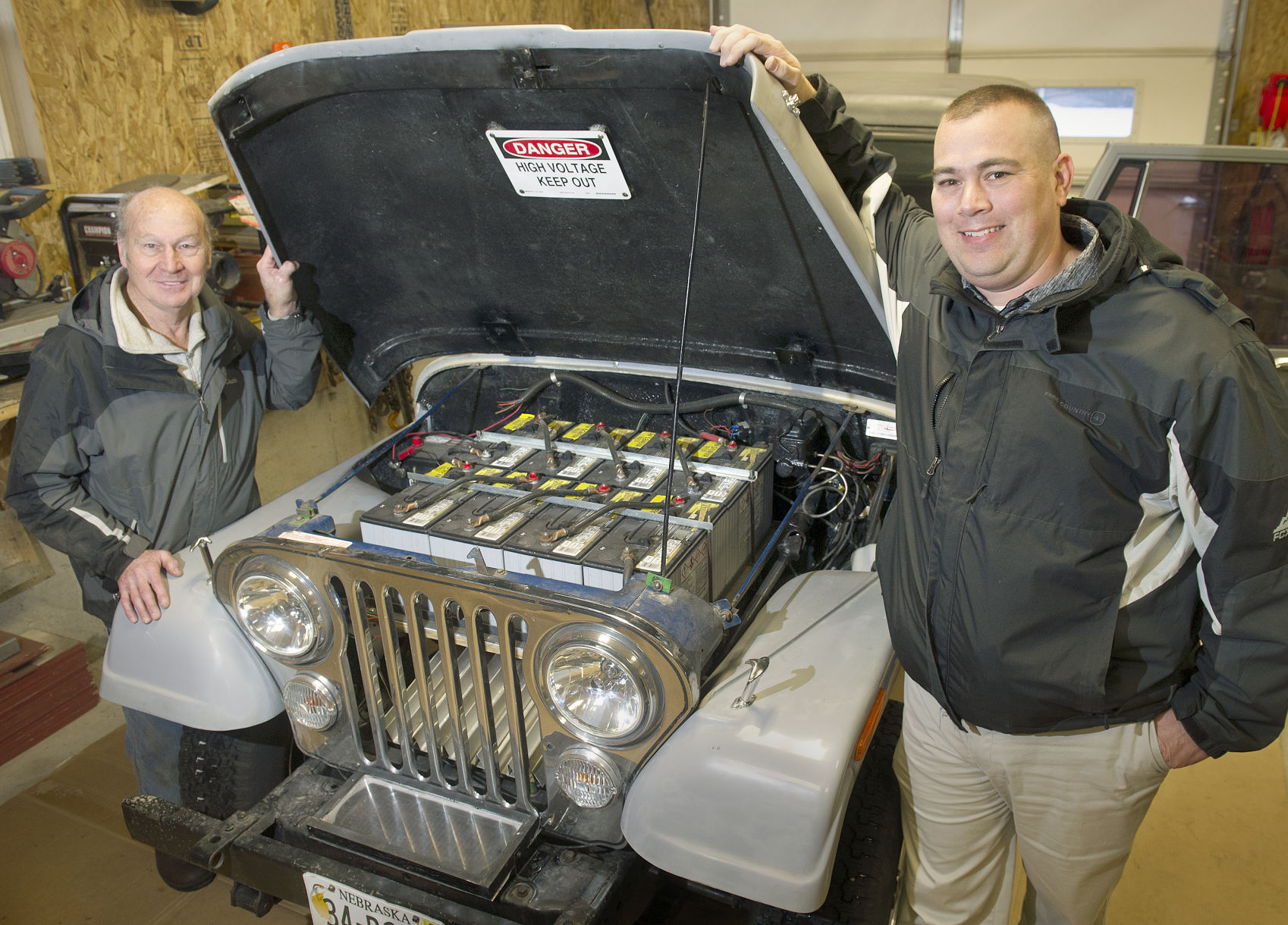 In Geneva teacher gives old Jeep new electrical power