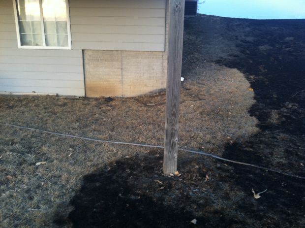 Man uses hose to save home