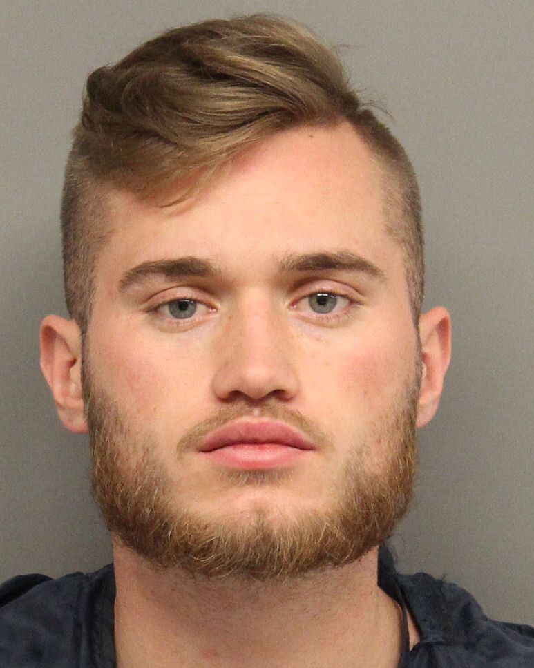 Man found passed out in car charged with drug possession