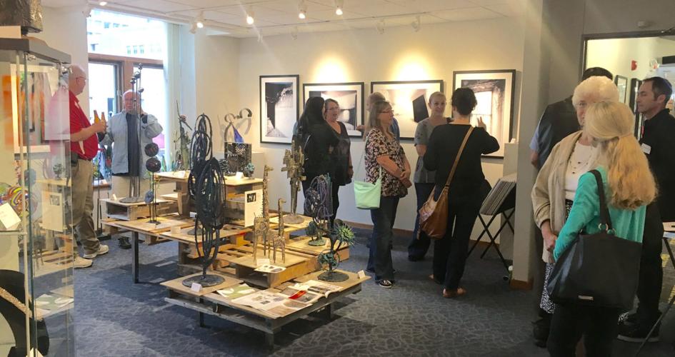 Guests visit with artists at Chapin Studios and Gallery