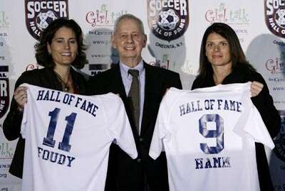 Five-time All-Star Nomar Garciaparra, right, holds his new Los Angeles  Dodgers' jersey with his wife, former soccer star Mia Hamm, during a news  conference announcing his signing a one-year contract with the