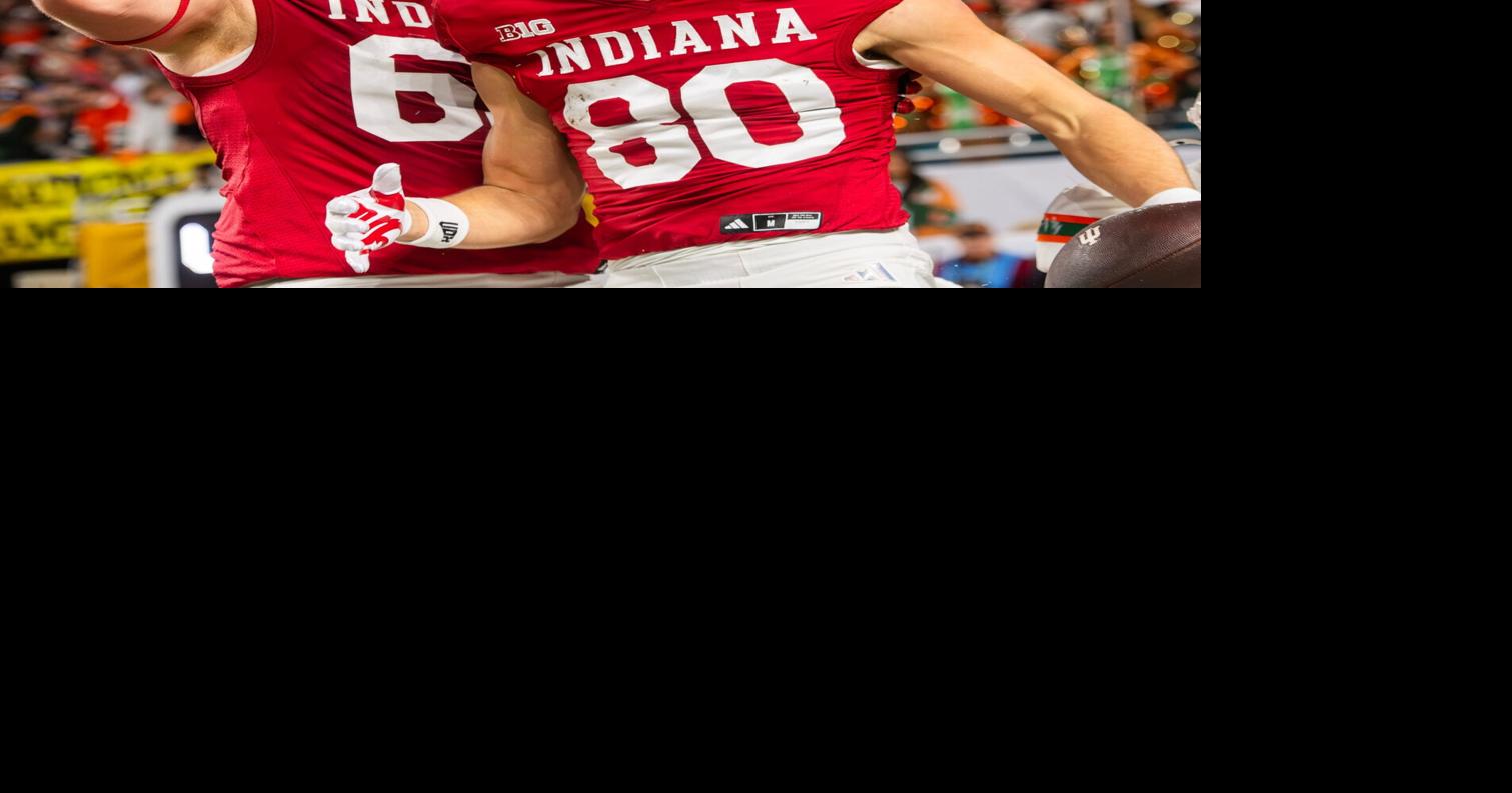 Indiana's Charlie Becker (80) celebrates with Carter Smith (65) on a touchdown that was ruled down before the endzone during the College Football Playoff National Championship college football game at Hard Rock Stadium in Miami Gardens on Monday, Jan. 19,