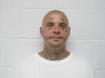 County attorney seeks to block defense from seeing grand jury report over cellmate killing