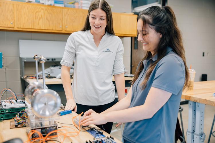 Photo 1_Right Size_Girls smiling in lab.jpg