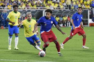American midfielder Tyler Adams says receiving online racial abuse is commonplace
