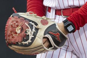 As NCAA mulls electronic communication devices in football, Nebraska softball offers shining example