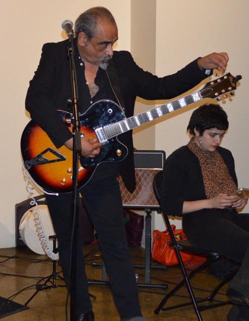 Gerardo Meza tunes his guitar