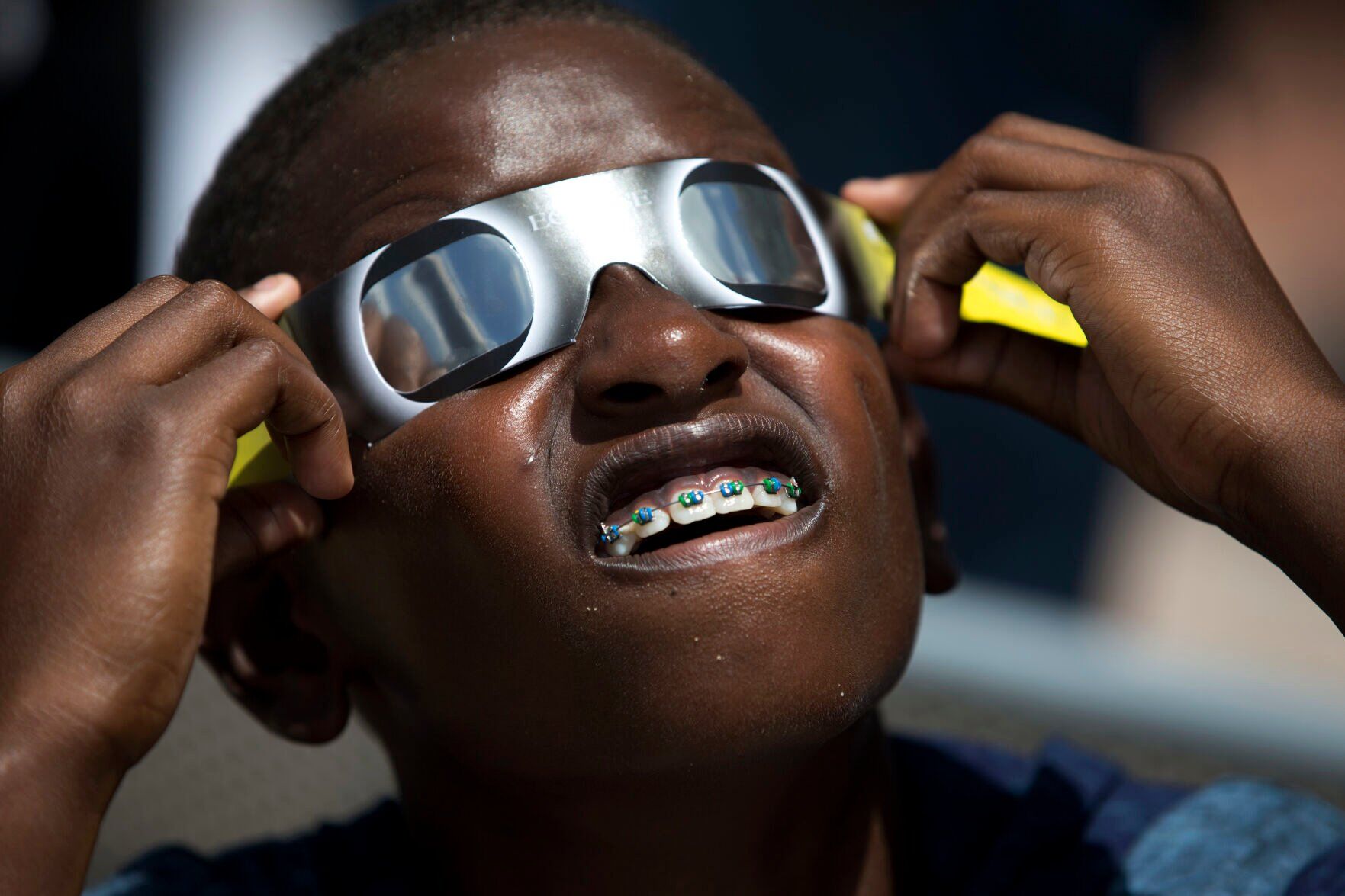 President Donald Trump and First Lady Melania Trump wear special solar  glasses as they view the total solar eclipse from the White House in  Washington, D.C. on August 21, 2017. Photo by