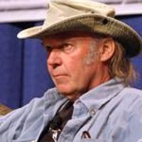 Despite criticisms, Neil Young works at his own pace