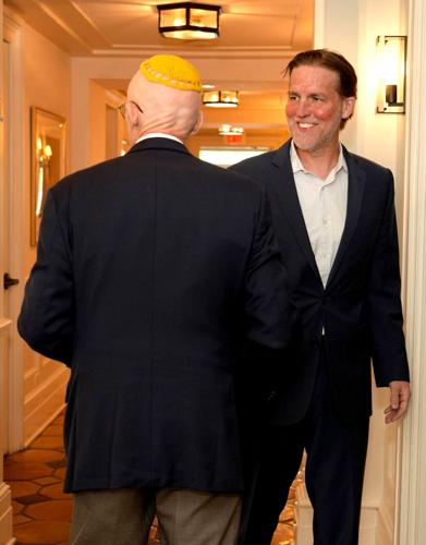 Former U.S. Sen. Ben Sasse, right, arrives for a talk at the Palm Beach Synagogue April 15, 2026 in Palm Beach.