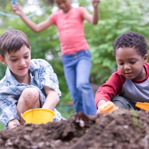 Active kids playing in dirt
