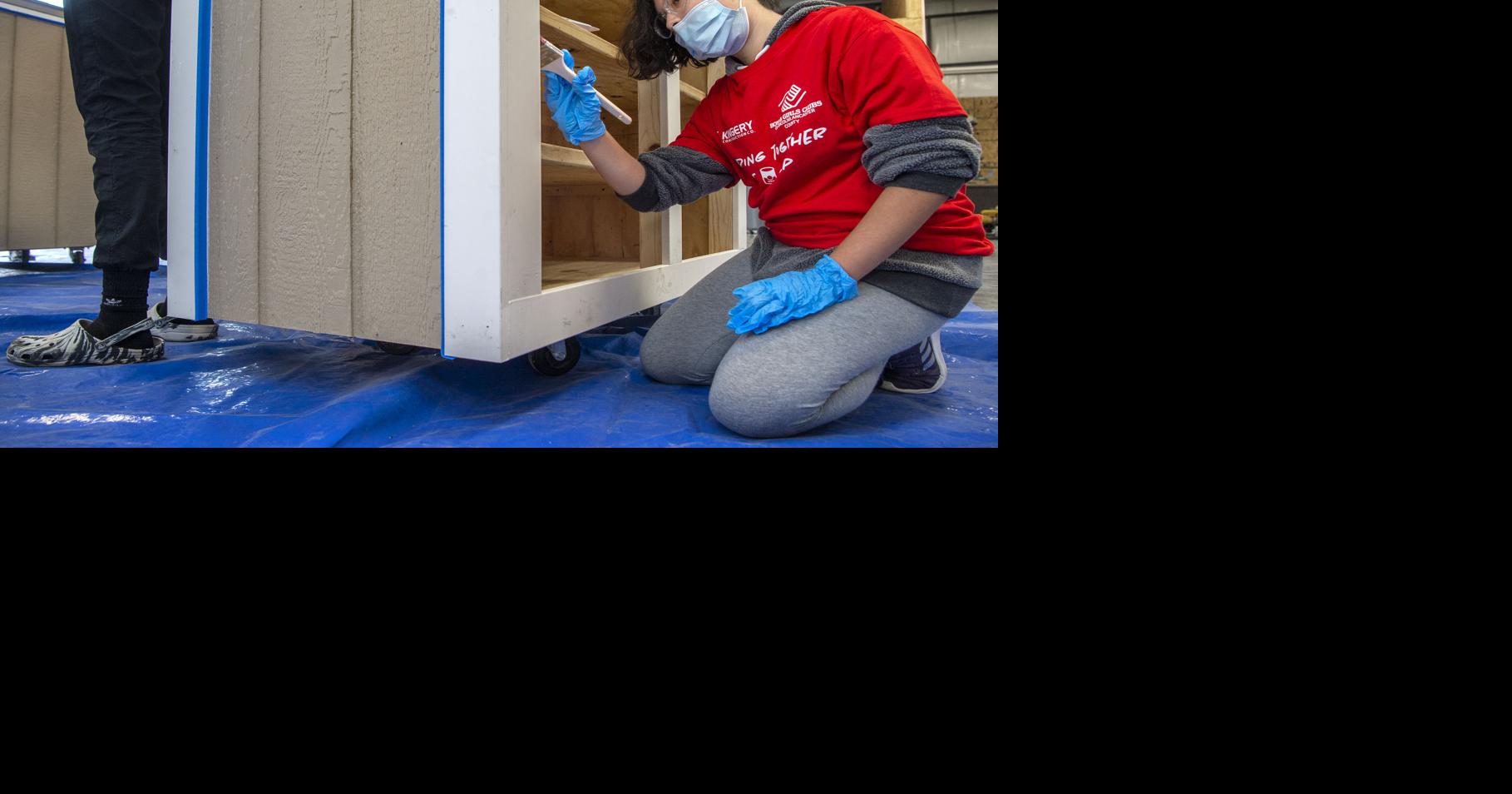 With paint brushes, hammers and nail guns, Lincoln high schoolers roll